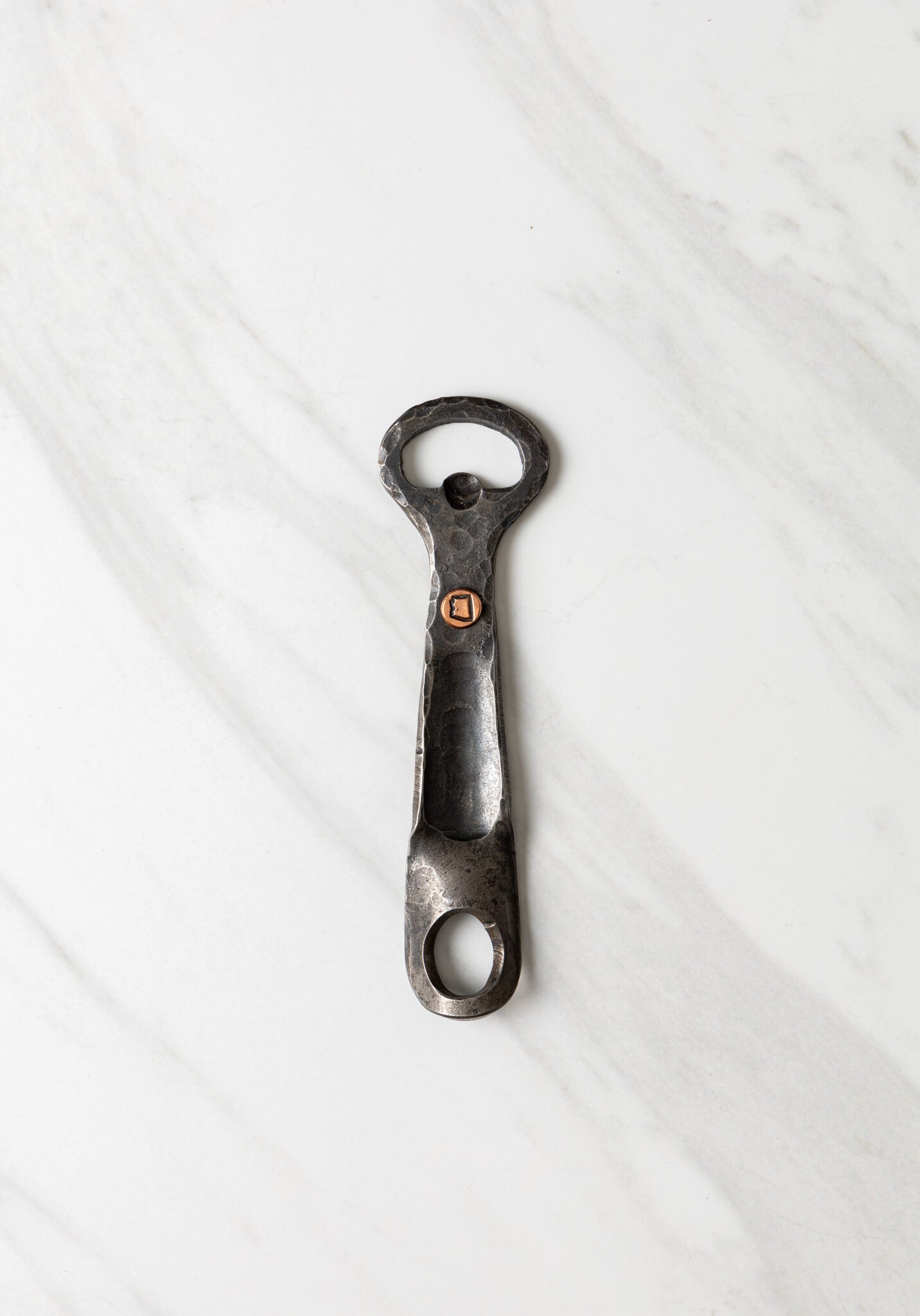 http://copperstateforge.com/cdn/shop/products/forged-bottle-opener-marble-background.jpg?v=1653866809